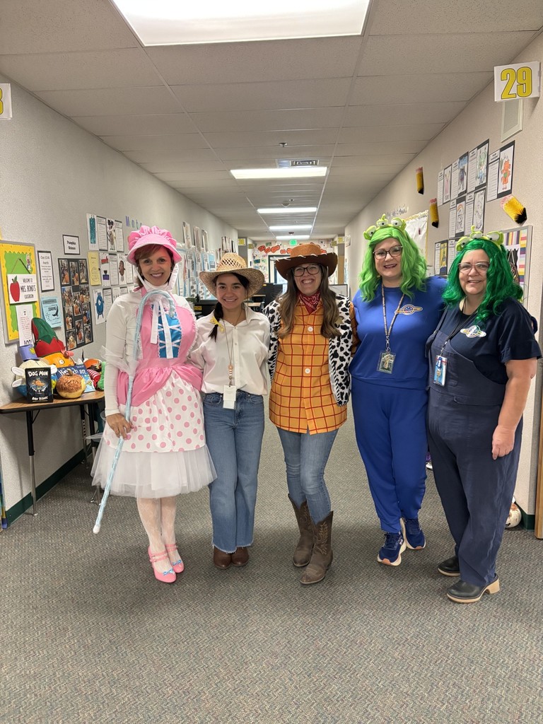 3rd grade teachers dressed as Toy Story on Halloween