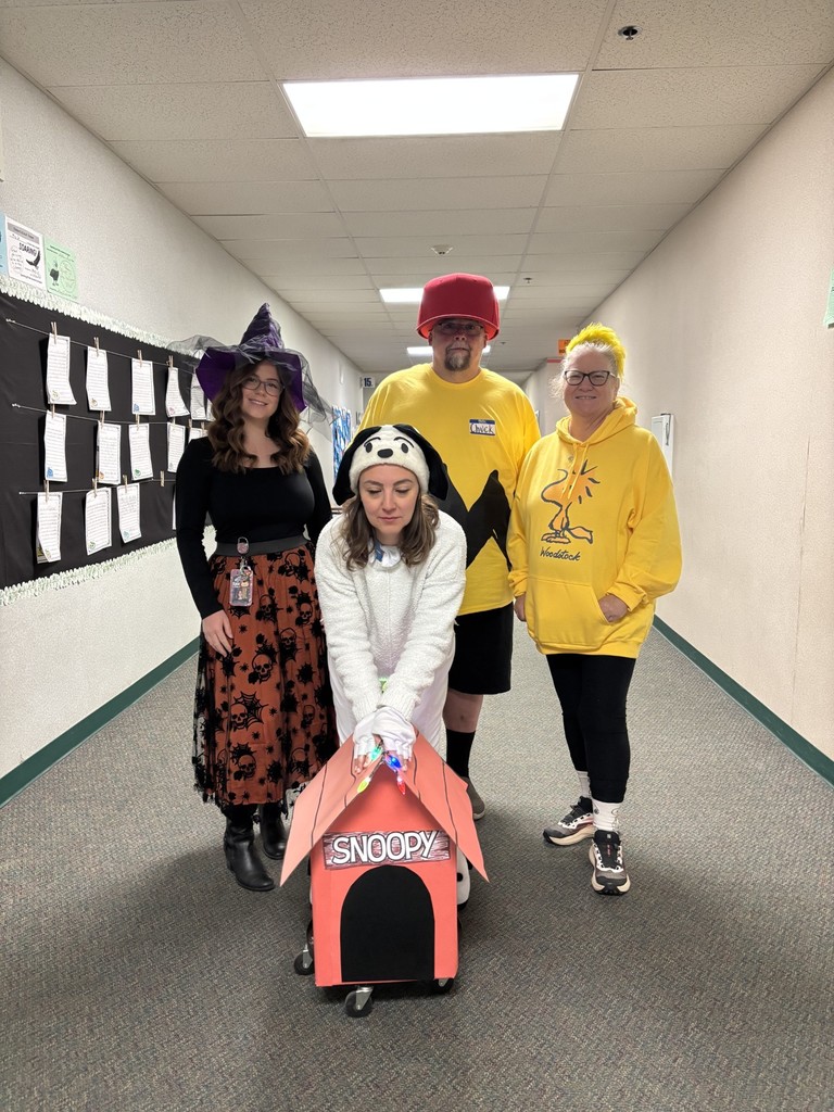2nd grade teachers dressed as Charlie Brown on Halloween