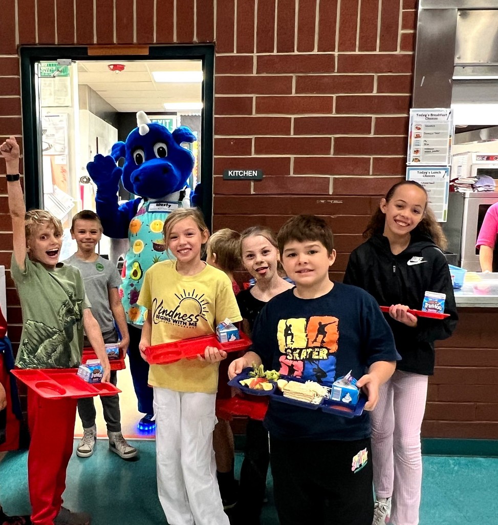 Westy the Dragon in the cafeteria with kids