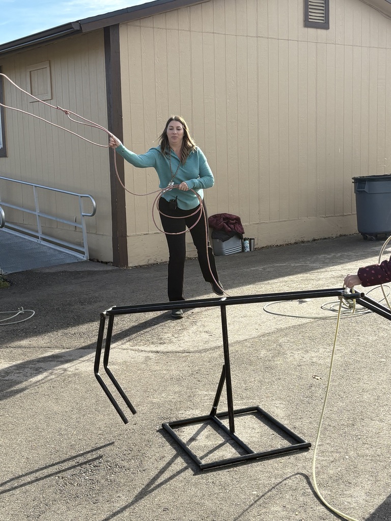 An image of current principal, Mrs. Burton practicing her Lasso skills