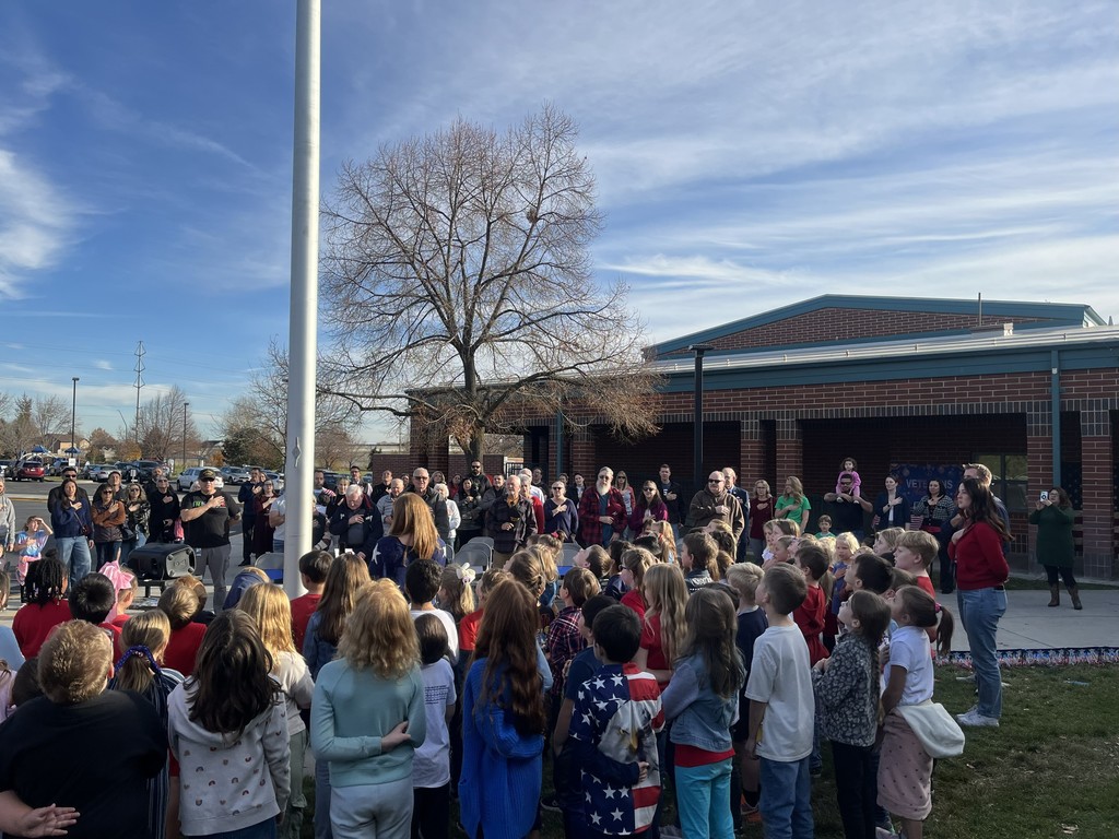 Veterans stand during an honor celebration for them