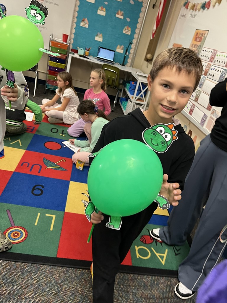third grader with his "Macy's Thanksgiving Day" balloon