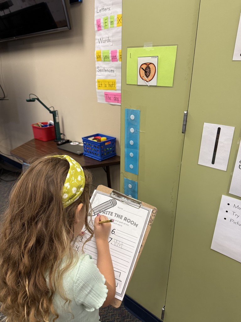 Kindergartener completing the "write the room" activity