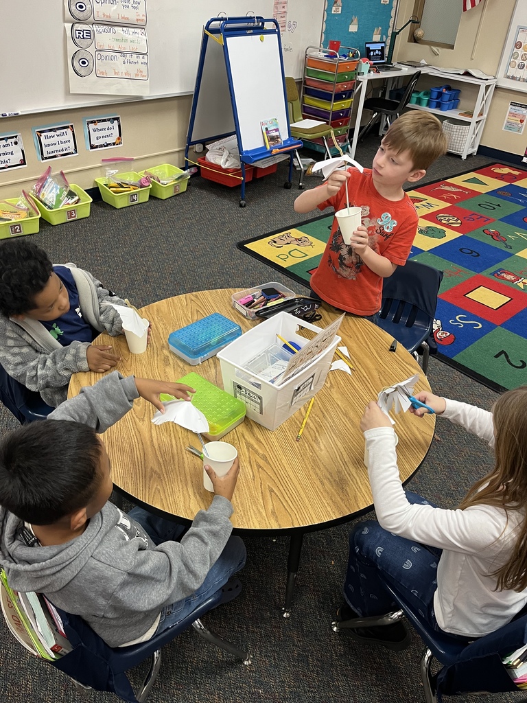 Mrs. Medley's first graders working on creating their umbrellas