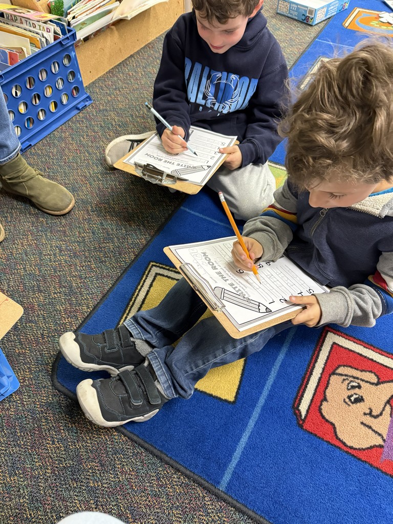 Kindergartener completing the "write the room" activity