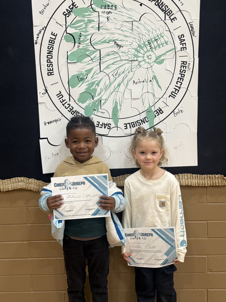 image of students holding awards