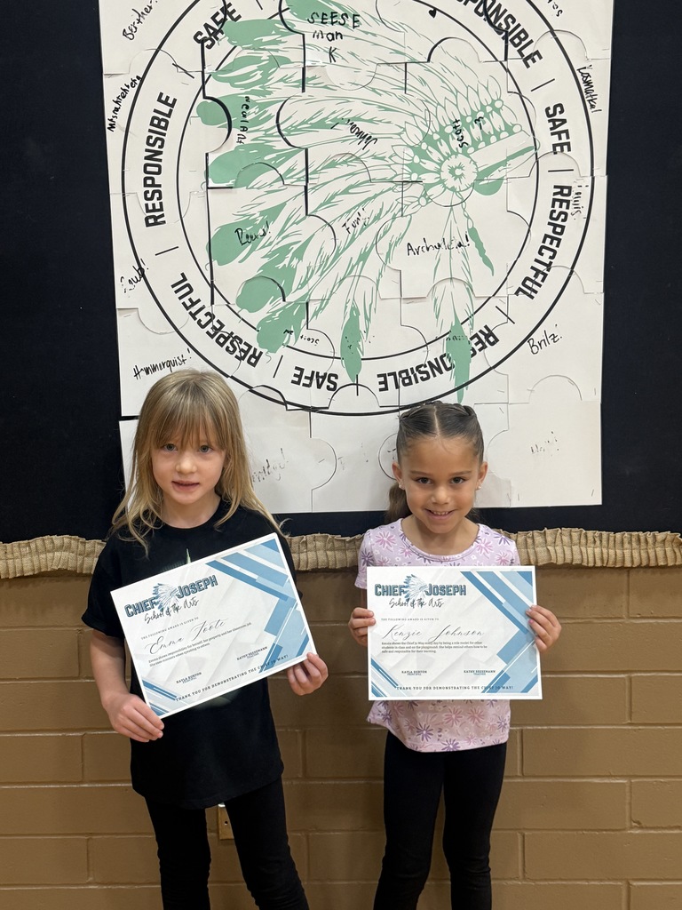 image of students holding awards