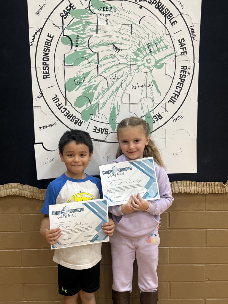 image of students holding awards
