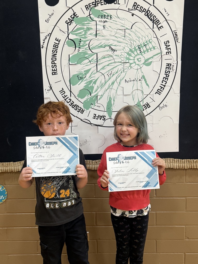 image of students holding awards