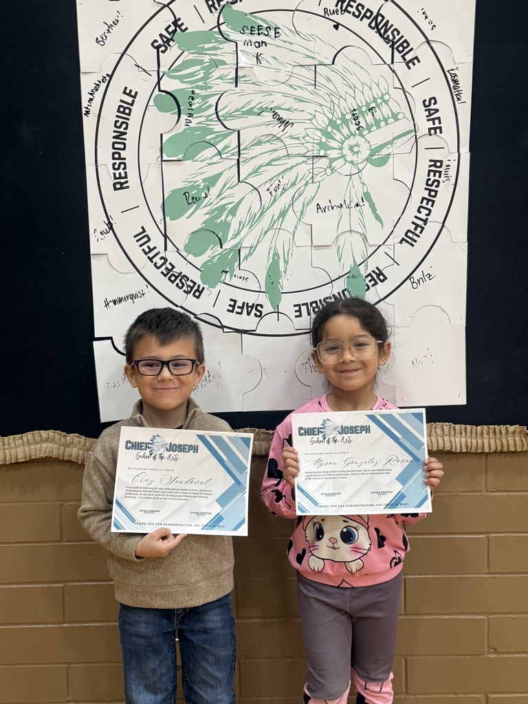 image of students holding awards
