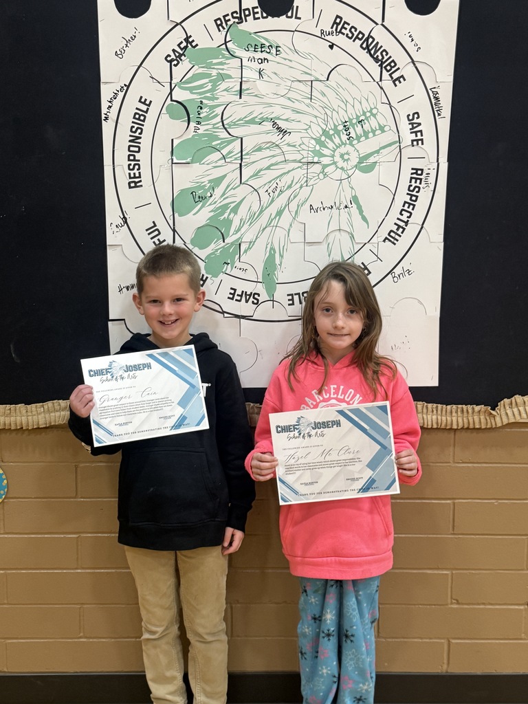 image of students holding awards