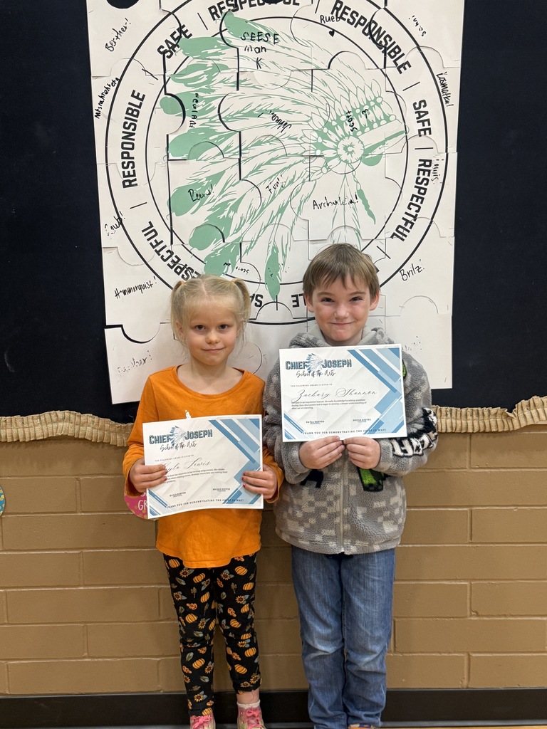 image of students holding awards
