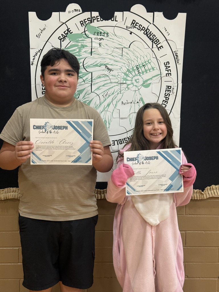 image of students holding awards