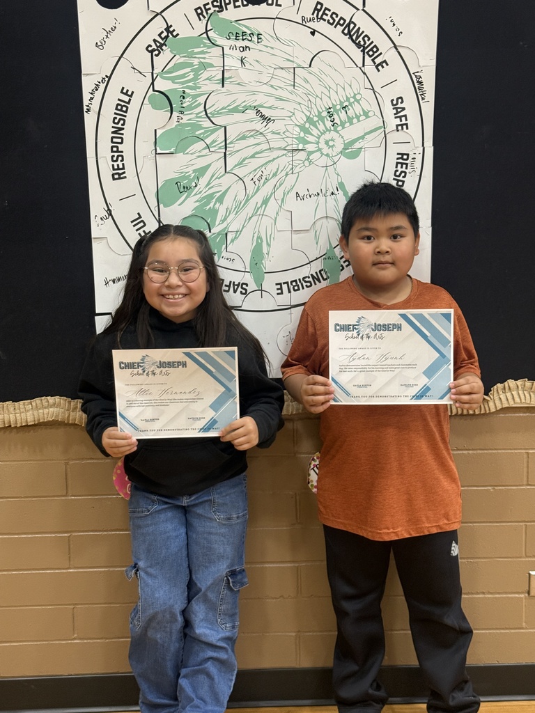 image of students holding awards
