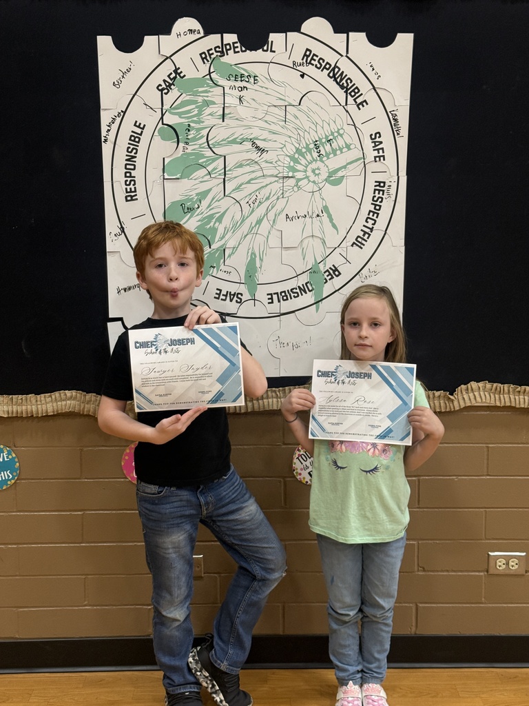 image of students holding awards