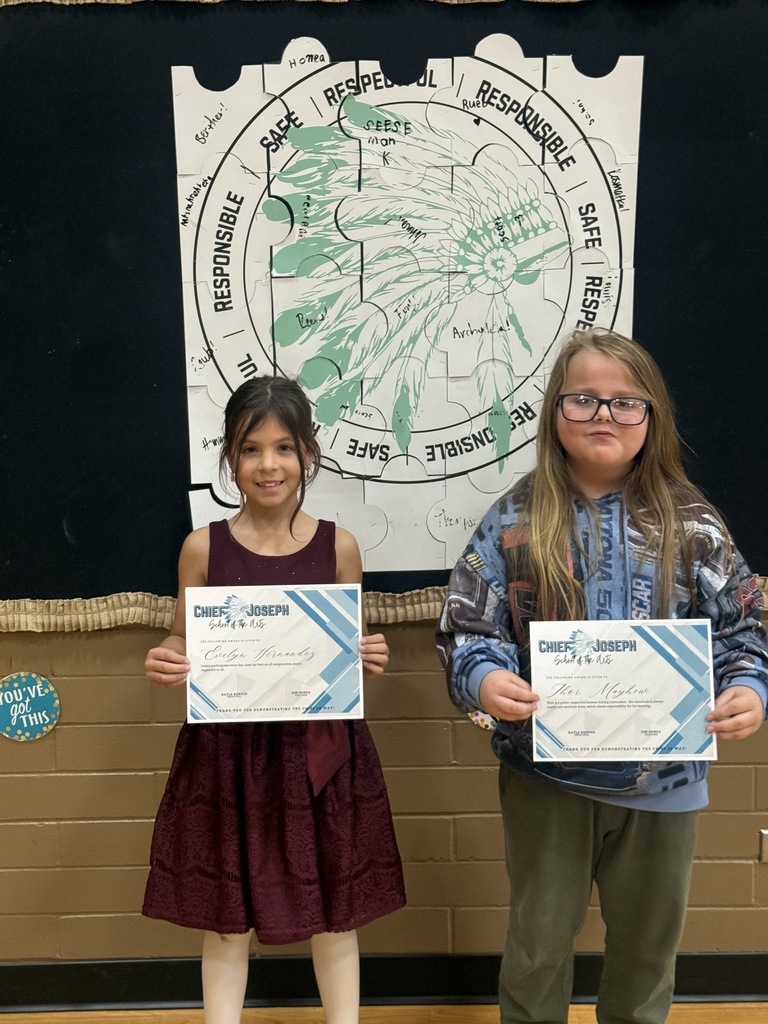image of students holding awards
