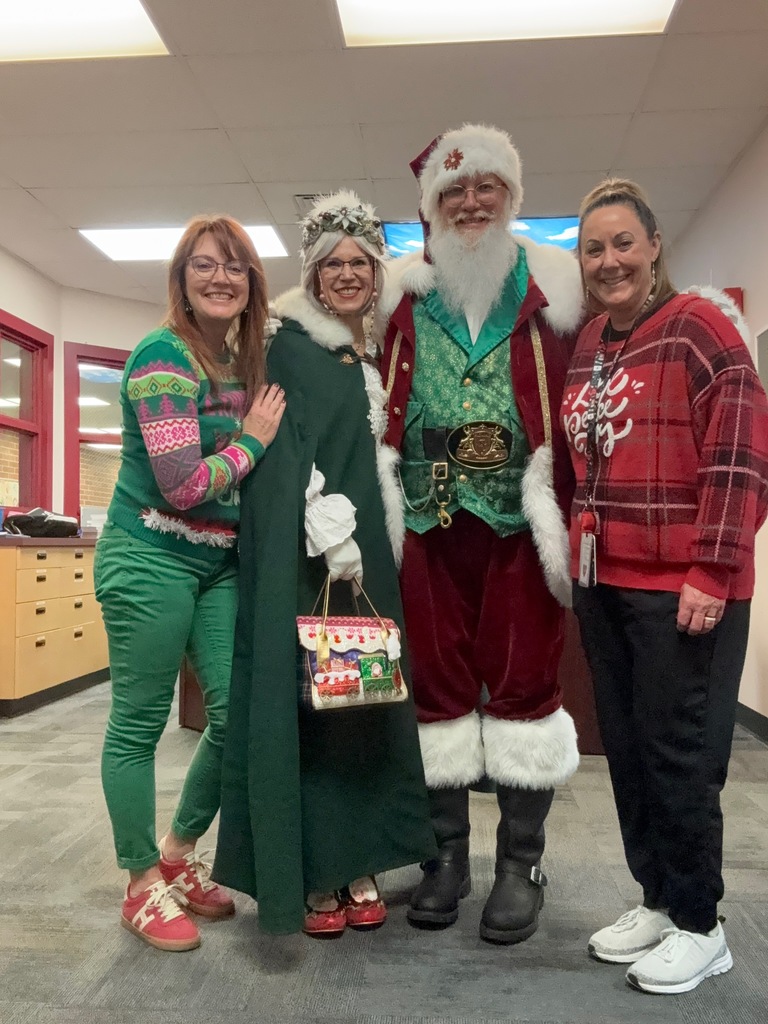 Santa and Mrs. Claus with 2 women