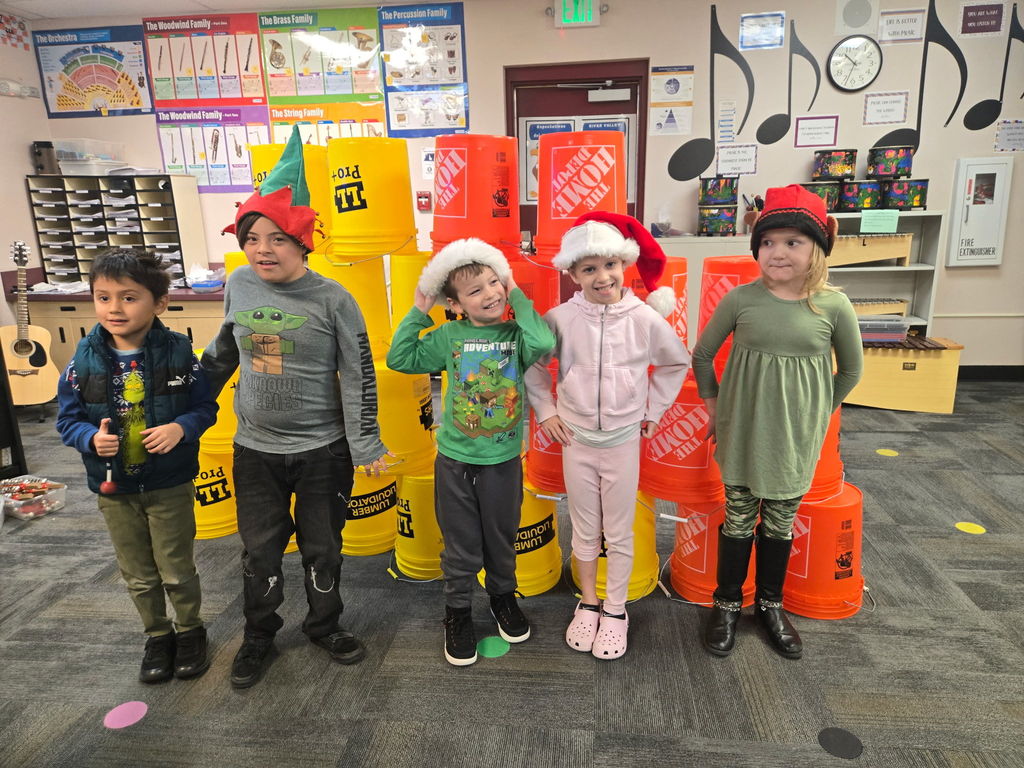 kids in school with yellow and orange buckets