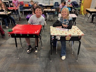 kids with decorated desks