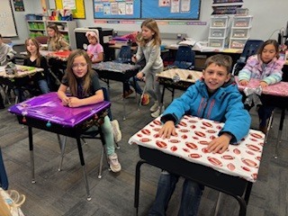 kids with decorated desks