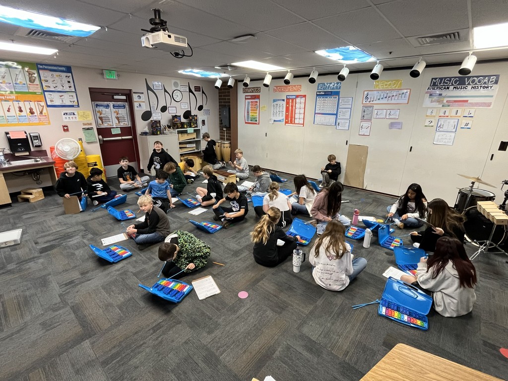 kids with instruments in a music room