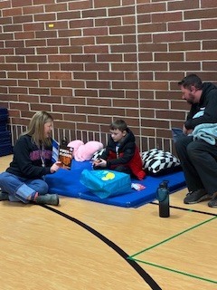 teacher reading to a student