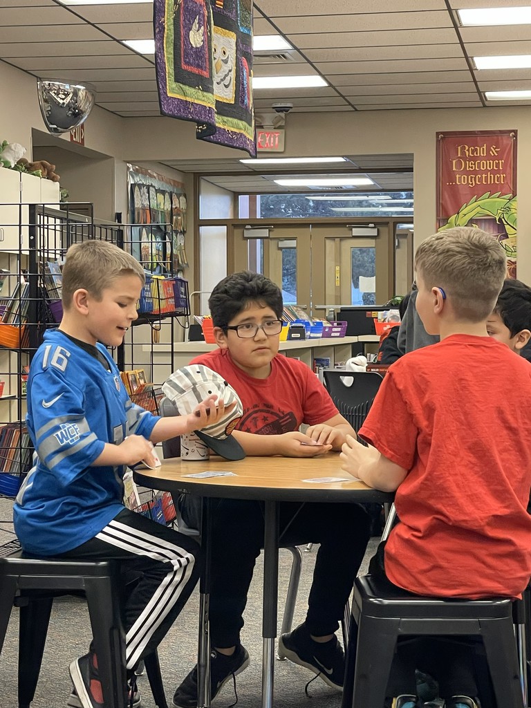  students playing card games. 