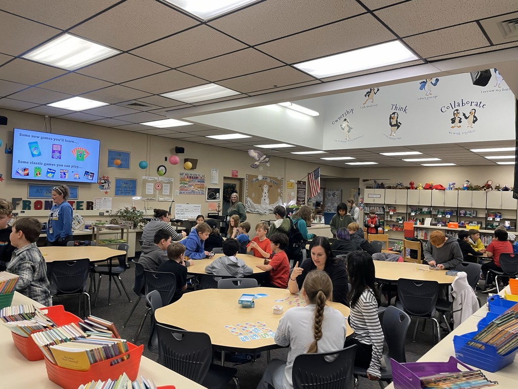 Staff and students playing card games. 