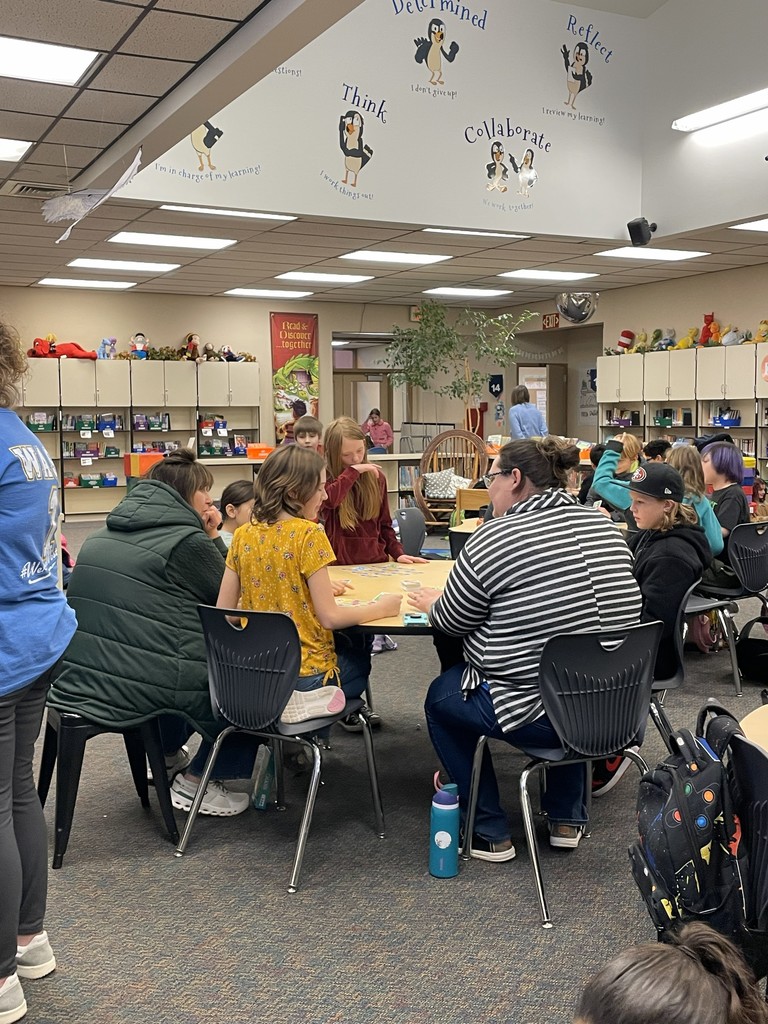 Staff and students playing card games. 