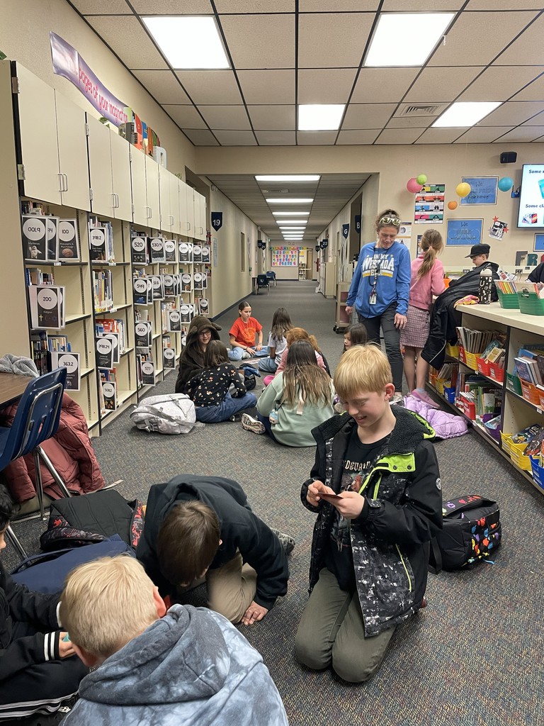 Staff and students playing card games. 