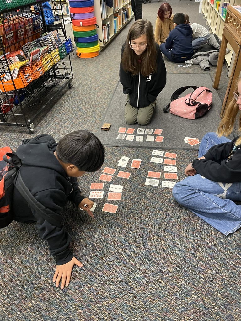  students playing card games. 