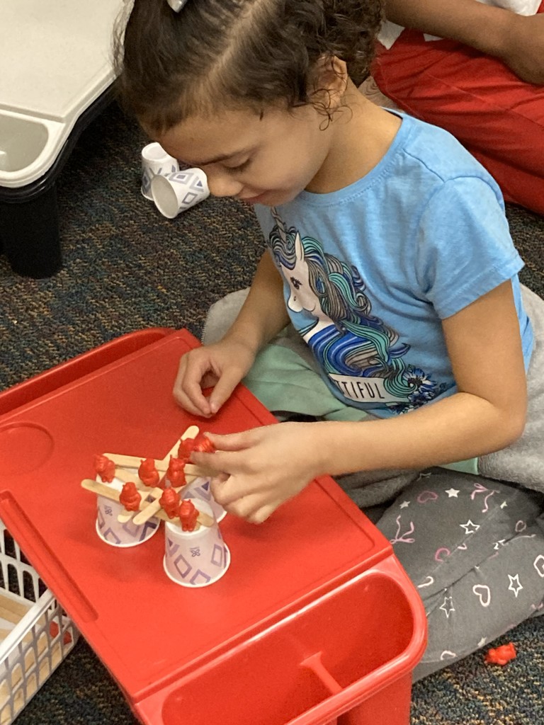 2nd graders building her "floor is lava" stem project