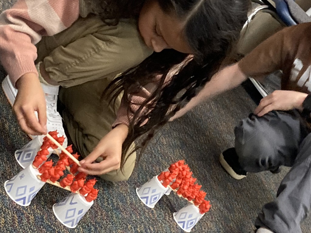 2nd graders building her "floor is lava" stem project