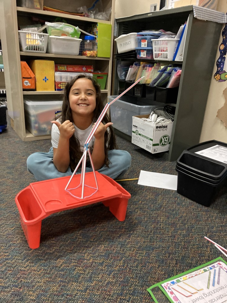 2nd graders building her "floor is lava" stem project