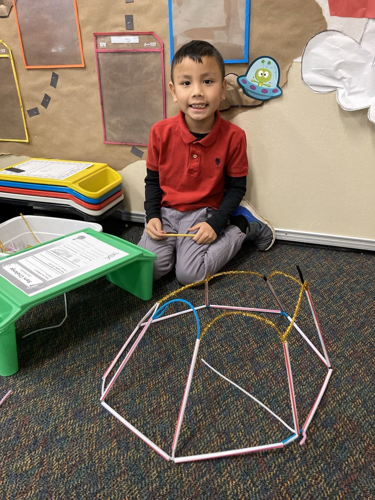 2nd graders building her "floor is lava" stem project