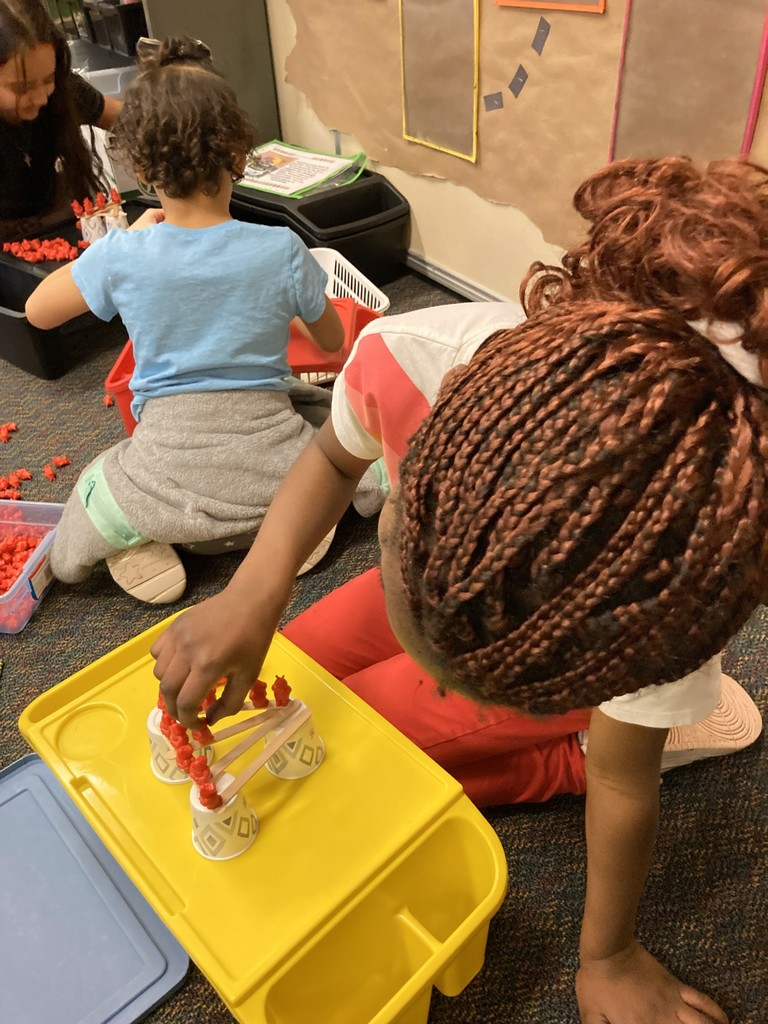2nd graders building her "floor is lava" stem project