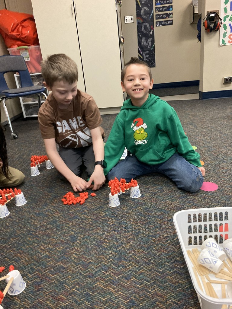 2nd graders building their "floor is lava" stem project