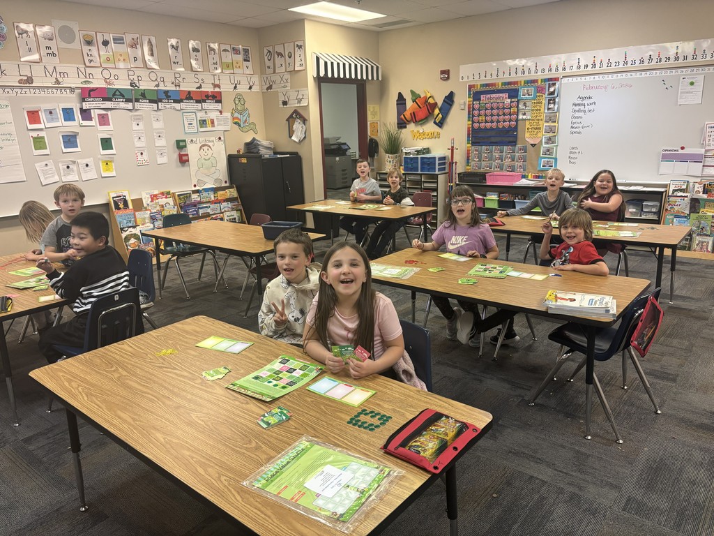 kids at desks in a classroom