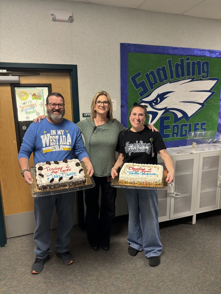 Mrs. Hampton, Principal, poses with Teacher of the Year, Jake Liberty, and Classified Employee of the Year, Tabitha Chamberlain.