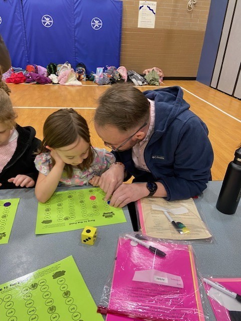 An image showing families playing learning games