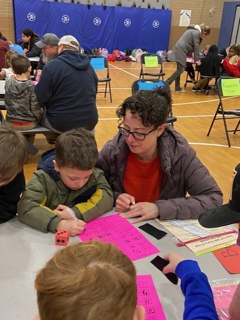 An image showing families playing learning games