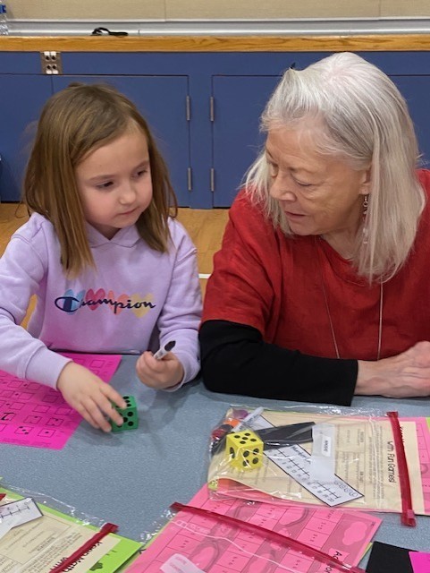An image showing people playing learning games