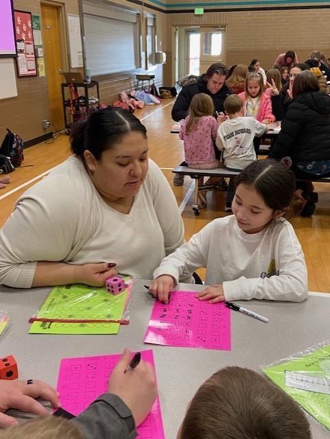An image showing families playing learning games