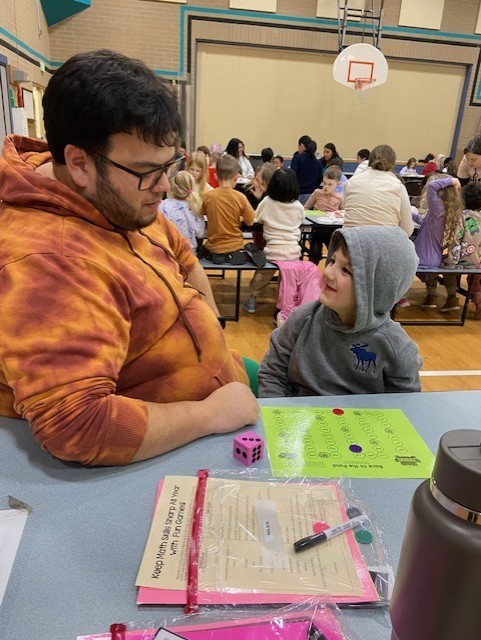 An image showing families playing learning games