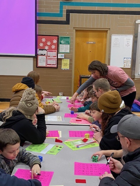 An image showing families playing learning games