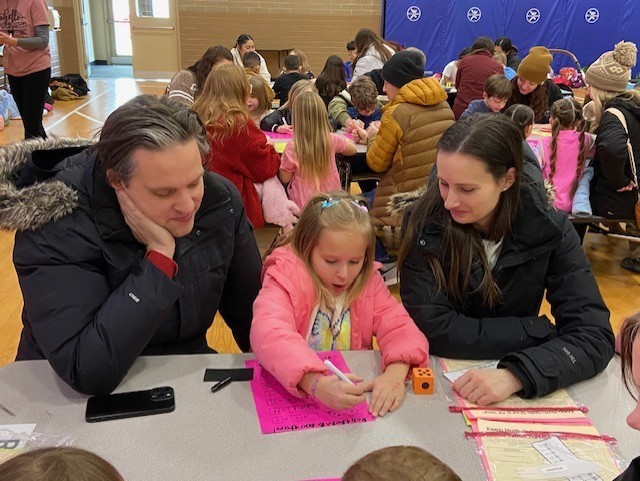 An image showing families playing learning games