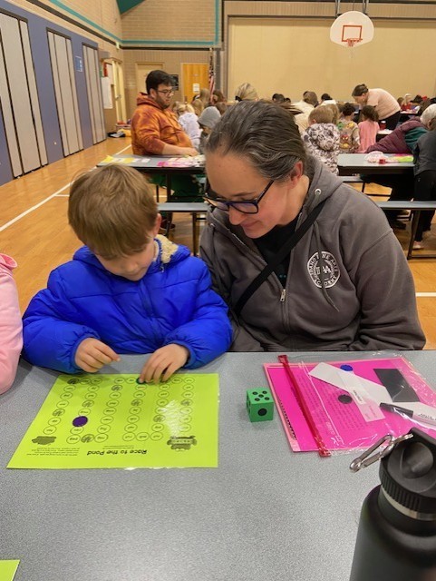 An image showing families playing learning games