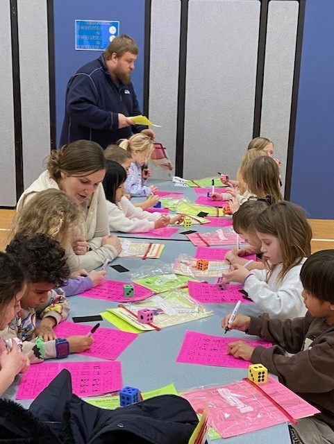 An image showing families playing learning games