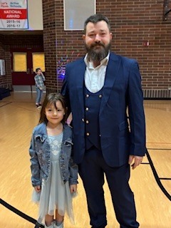 dad and daughter in gymnasium