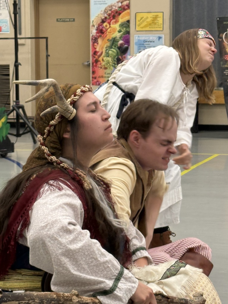 cast performing during play